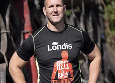 Man wearing a hell & back tshirt sponsored by londis