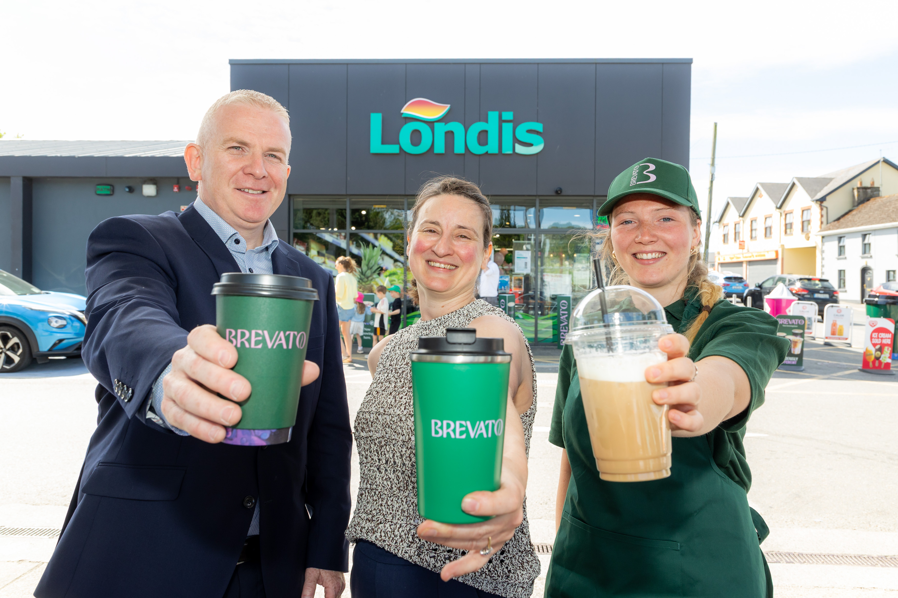 Image of Castlebridge team holding a coffee cup